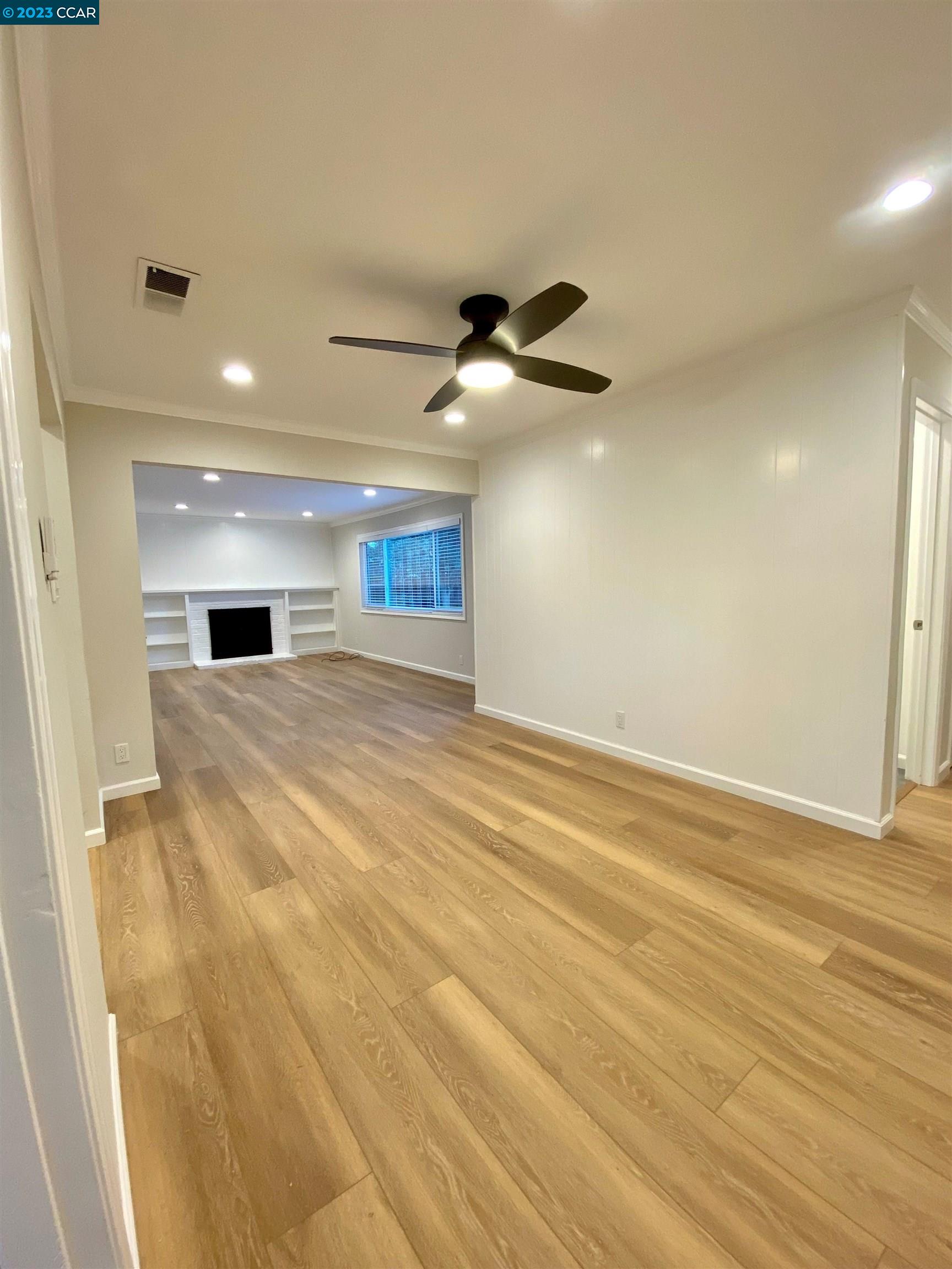 959 Duar Drive Concord, CA 94518 - Photo 5 of 14 a view of an empty room with a chandelier fan
