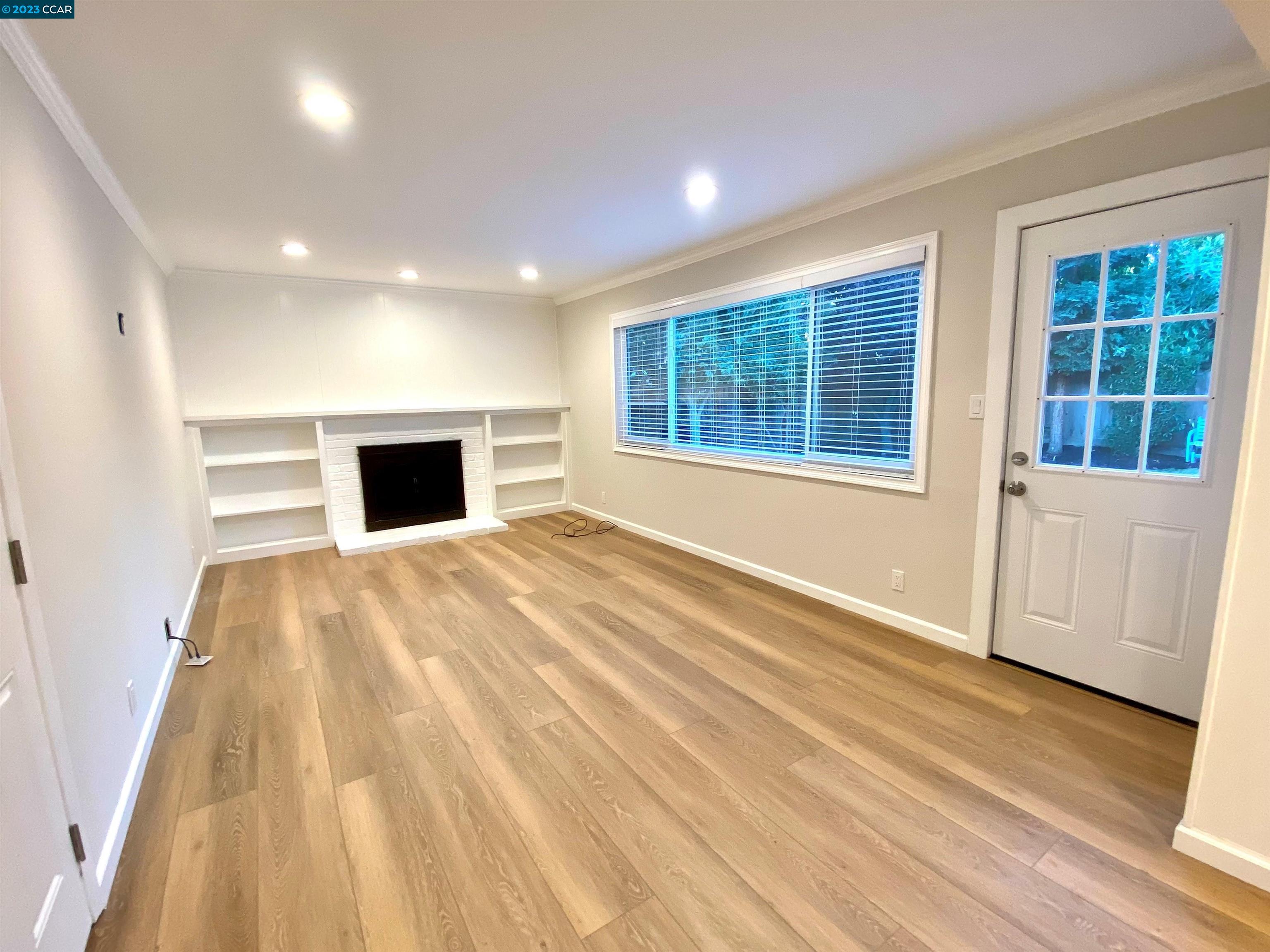 959 Duar Drive Concord, CA 94518 - Photo 6 of 14 a view of empty room with wooden floor and fan