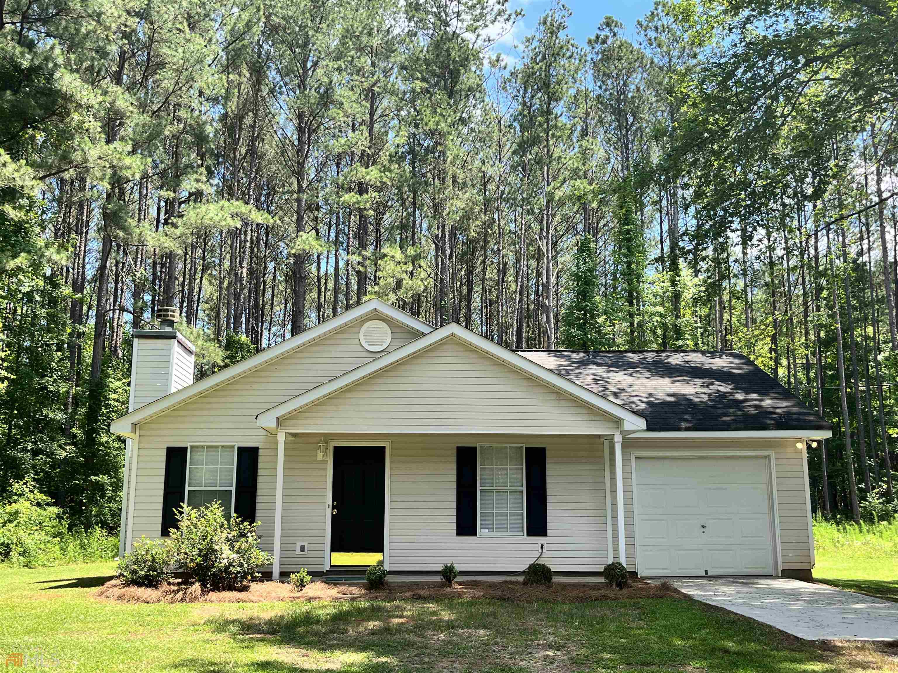 10575 Luthersville Road Gay, GA 30218 - Photo 1 of 1 a front view of a house with a yard