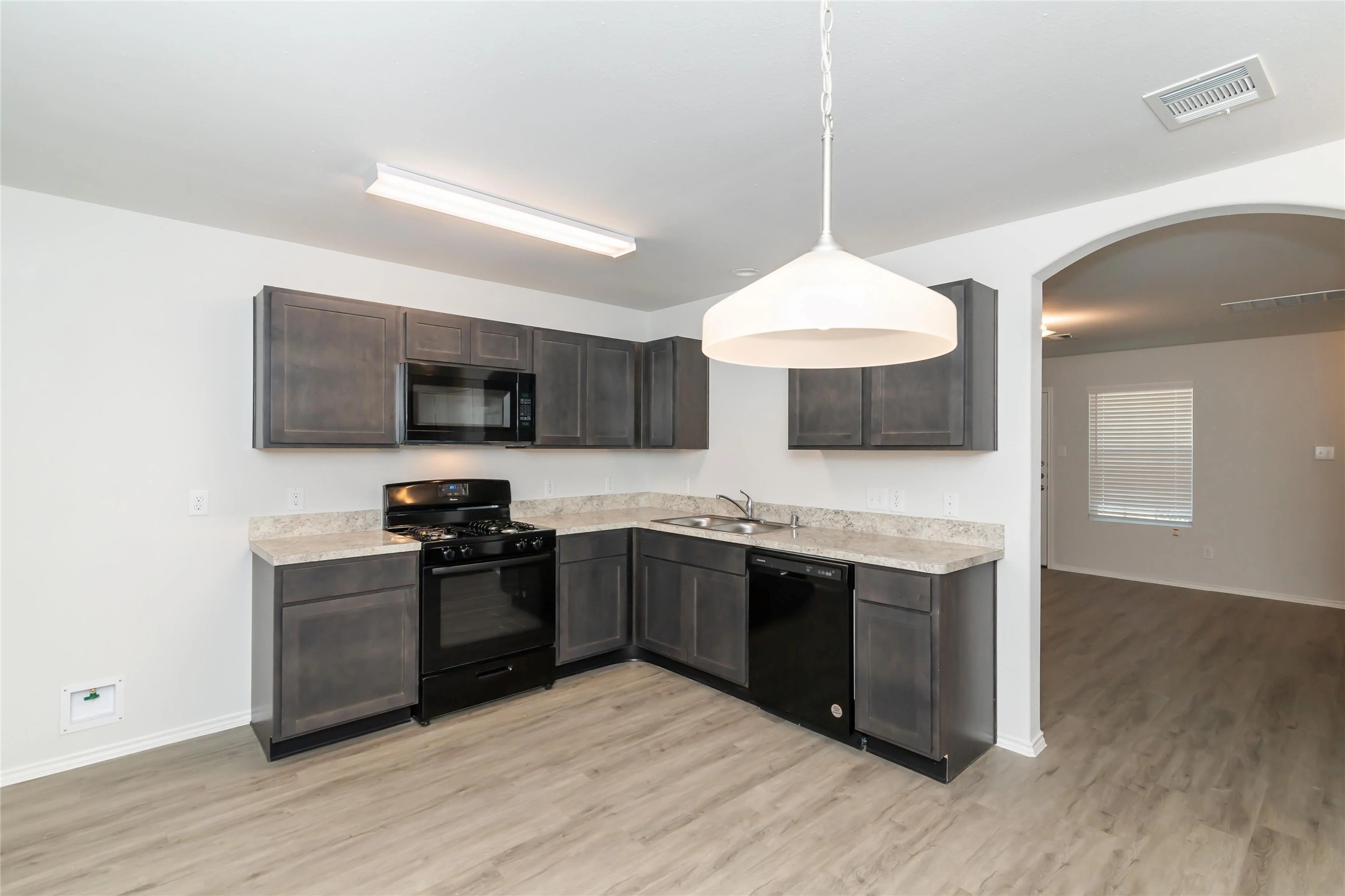 22406 Porter Mountain Trail Porter, TX 77365 - Photo 7 of 11 a kitchen with stainless steel appliances granite countertop a stove and a sink