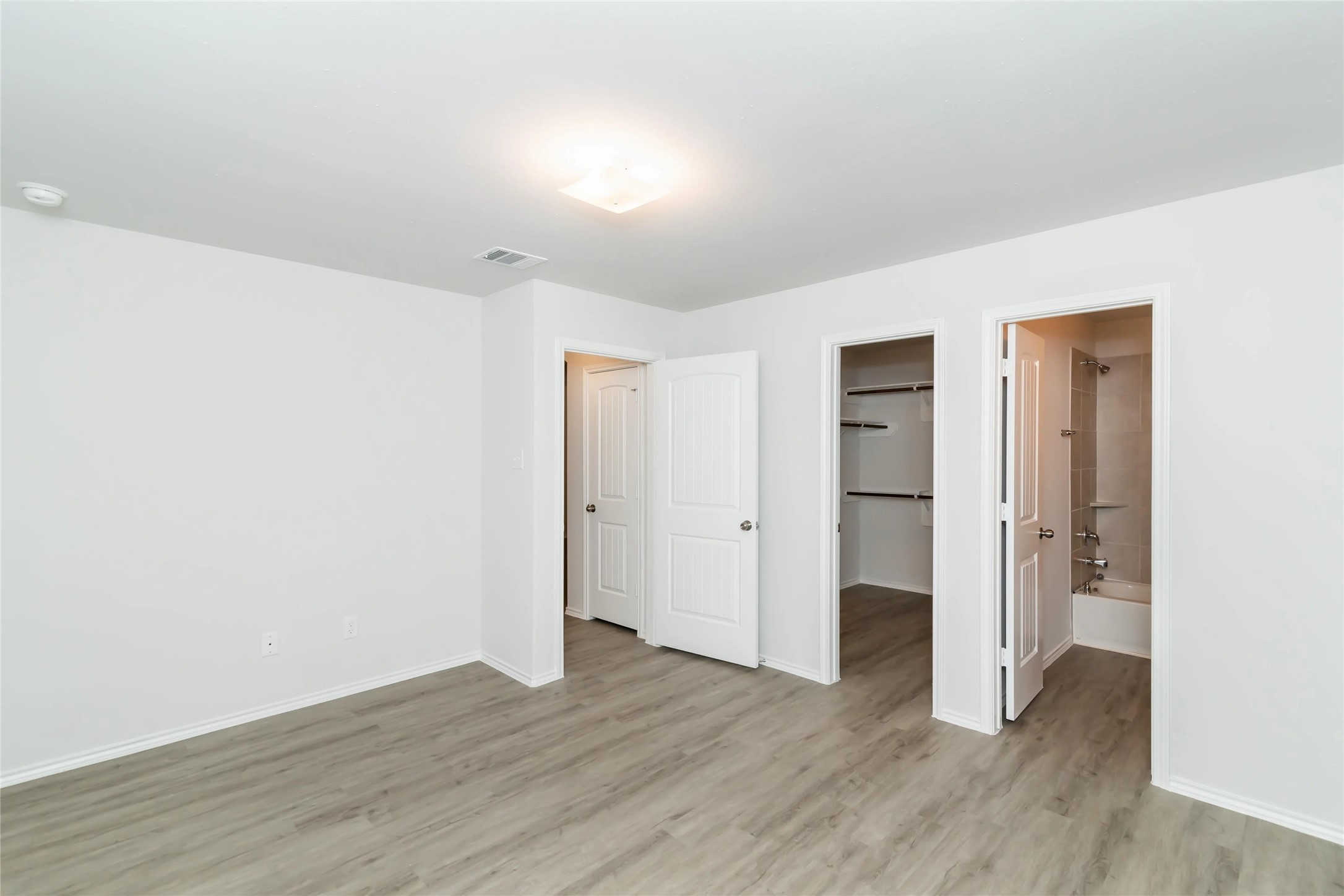 22406 Porter Mountain Trail Porter, TX 77365 - Photo 8 of 11 a view of an empty room with wooden floor