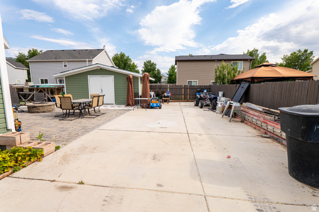 1443 West 250 North Springville, UT 84663 - Photo 23 of 23 Expansive outdoor space featuring a concrete patio, paver patio, and a dedicated storage shed