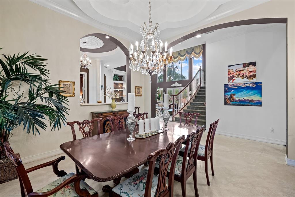 12794 Stonebrook Drive Davie, FL 33330 - Photo 12 of 45 a view of a dining room with furniture and chandelier