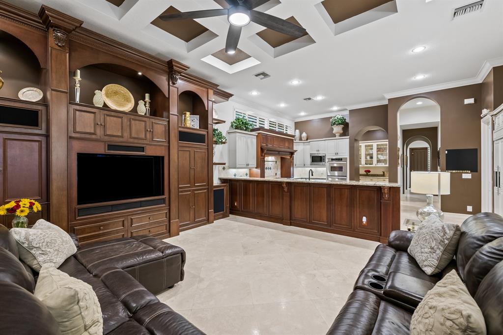 12794 Stonebrook Drive Davie, FL 33330 - Photo 21 of 45 a living room with furniture a flat screen tv and kitchen view