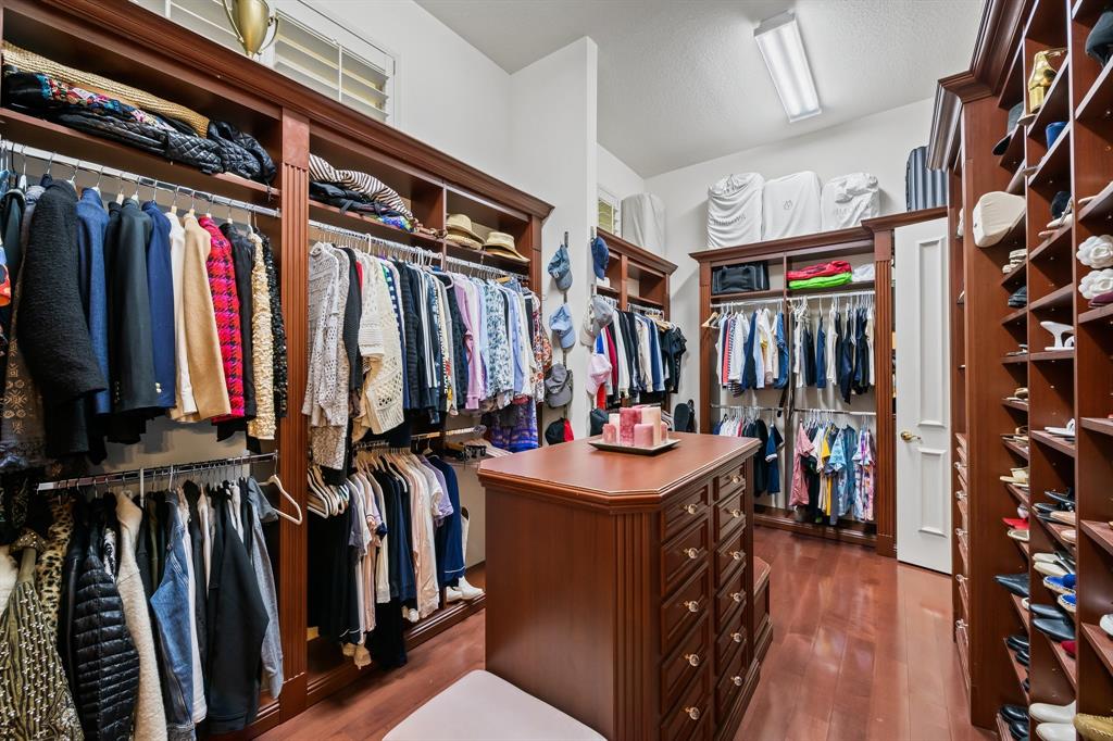 12794 Stonebrook Drive Davie, FL 33330 - Photo 27 of 45 a view of walk in closet with clothes