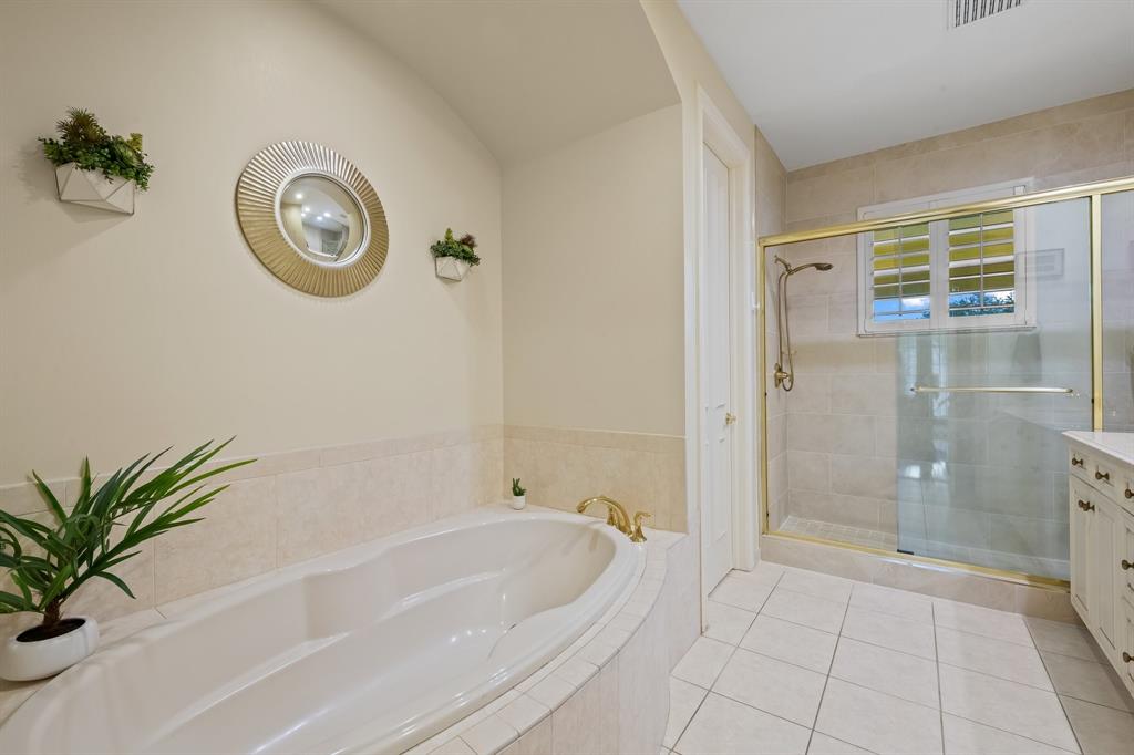 12794 Stonebrook Drive Davie, FL 33330 - Photo 31 of 45 a spacious bathroom with a tub and a shower
