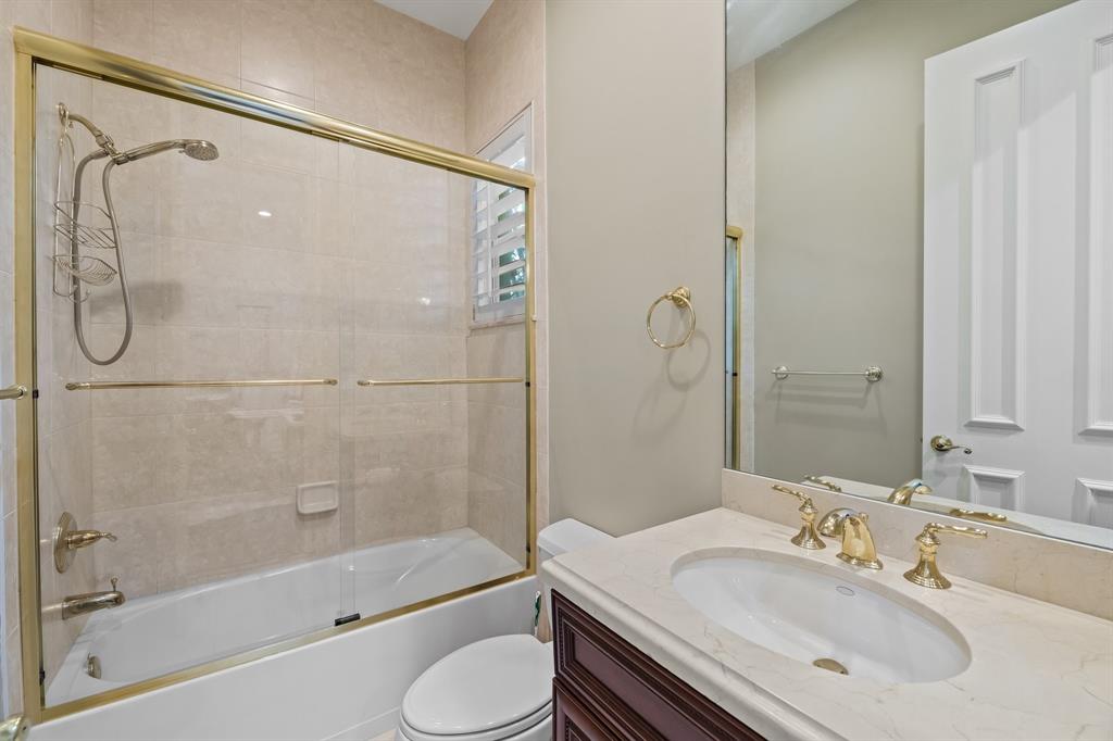 12794 Stonebrook Drive Davie, FL 33330 - Photo 43 of 45 a bathroom with a sink toilet and shower