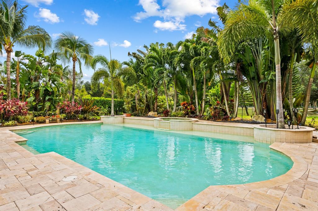 12794 Stonebrook Drive Davie, FL 33330 - Photo 7 of 45 a view of swimming pool with a garden
