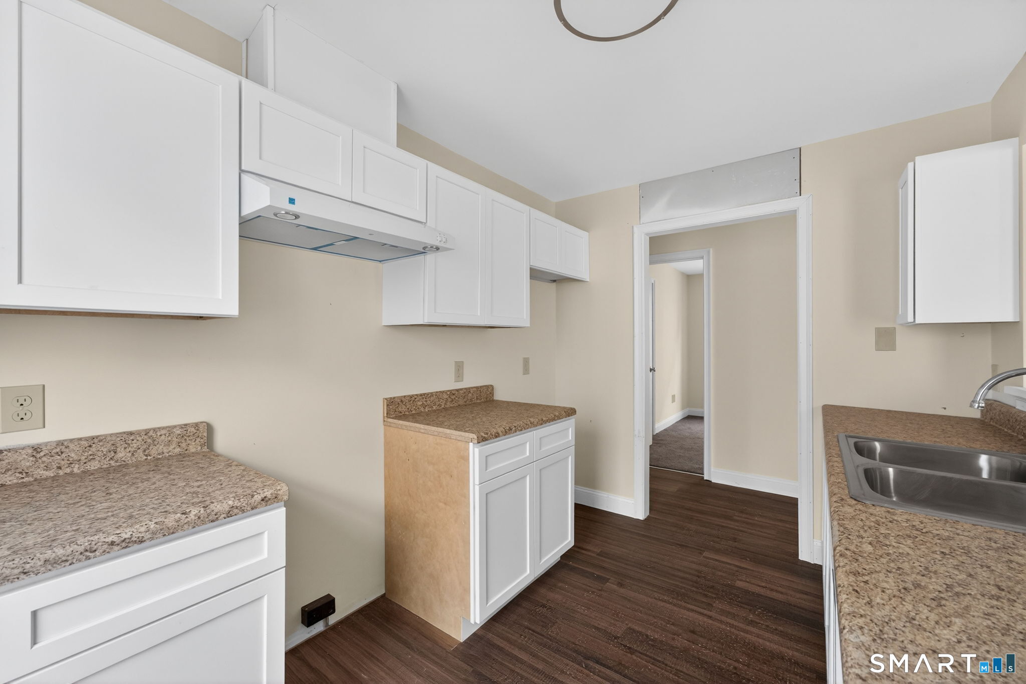 570 Zion Street Hartford, CT 06106 - Photo 12 of 40 a kitchen with stainless steel appliances granite countertop a sink stove and cabinets