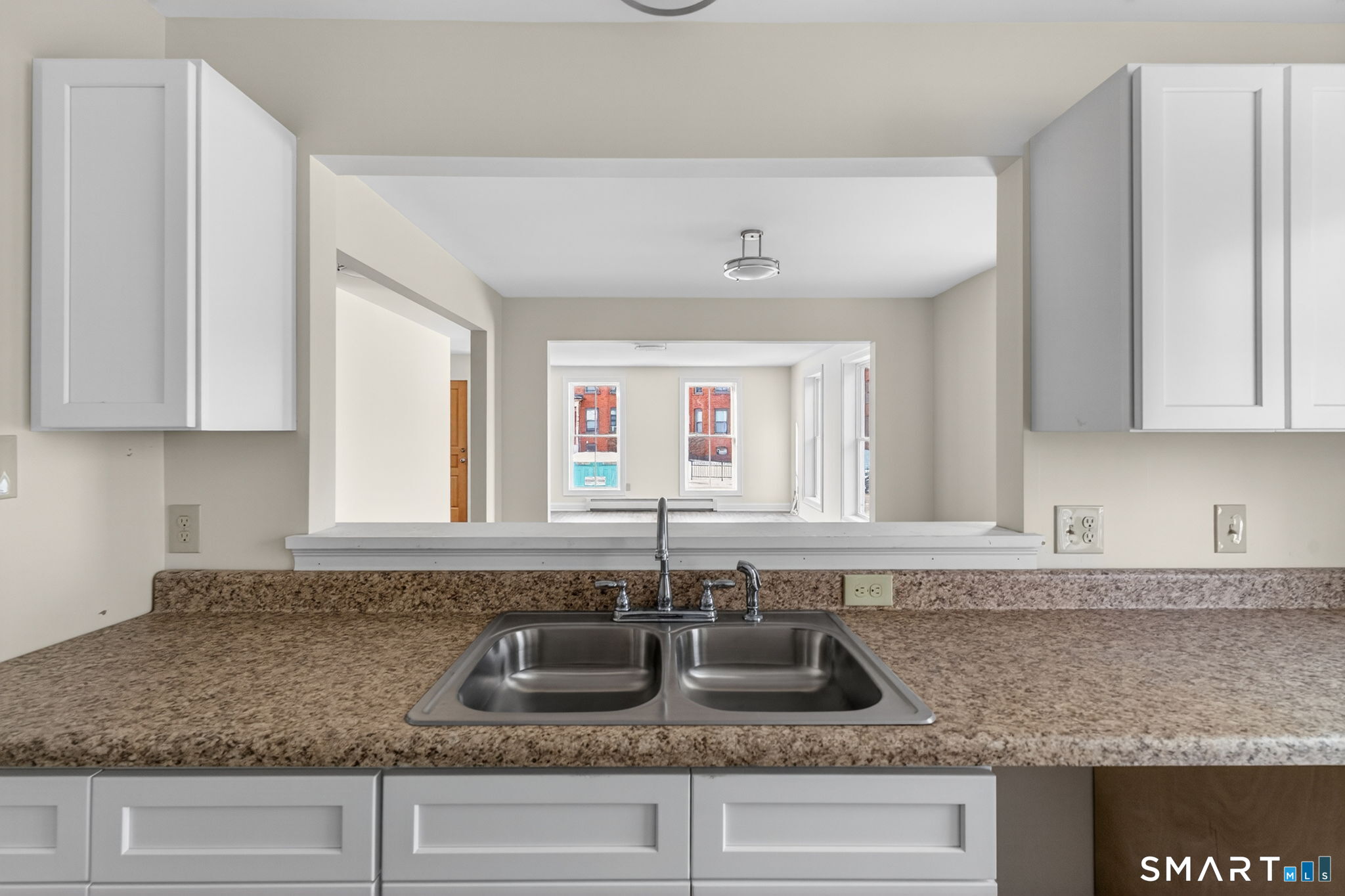 570 Zion Street Hartford, CT 06106 - Photo 13 of 40 a kitchen with granite countertop a sink and a granite counter tops