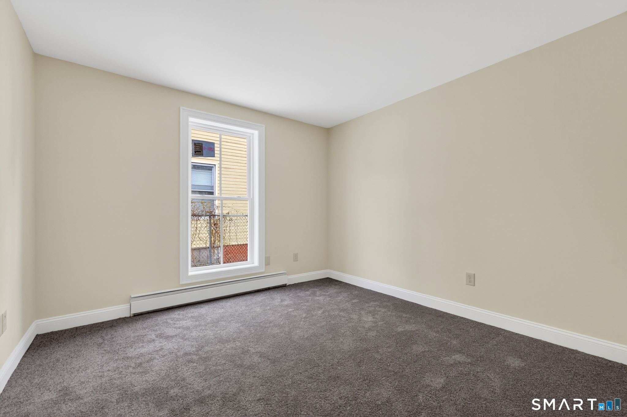 570 Zion Street Hartford, CT 06106 - Photo 14 of 40 an empty room with a window