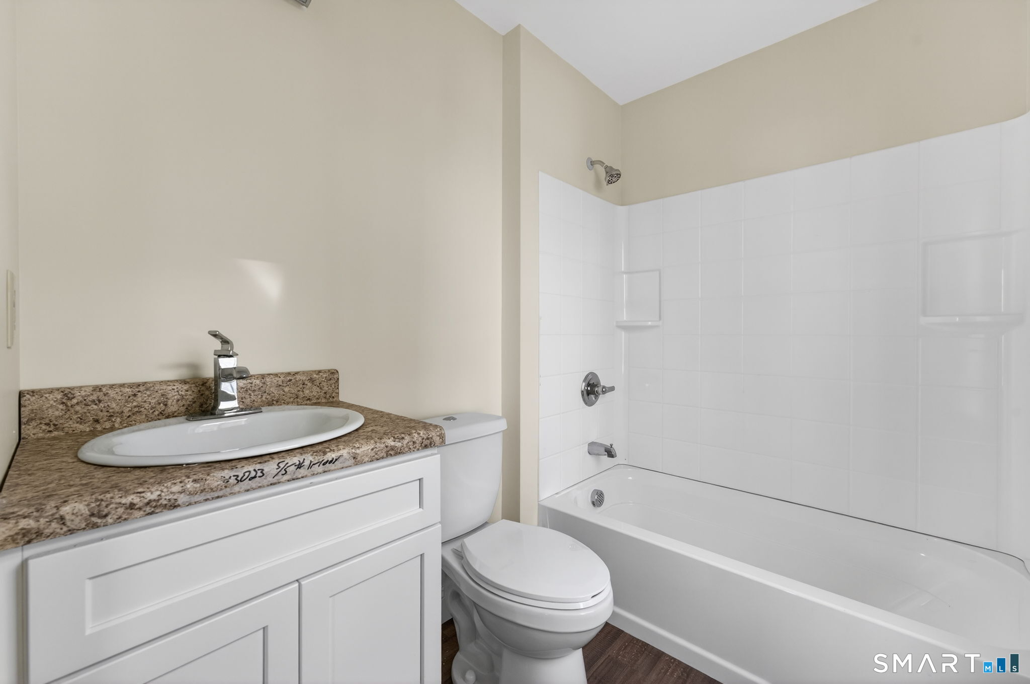 570 Zion Street Hartford, CT 06106 - Photo 21 of 40 a bathroom with a granite countertop sink a toilet and a bathtub