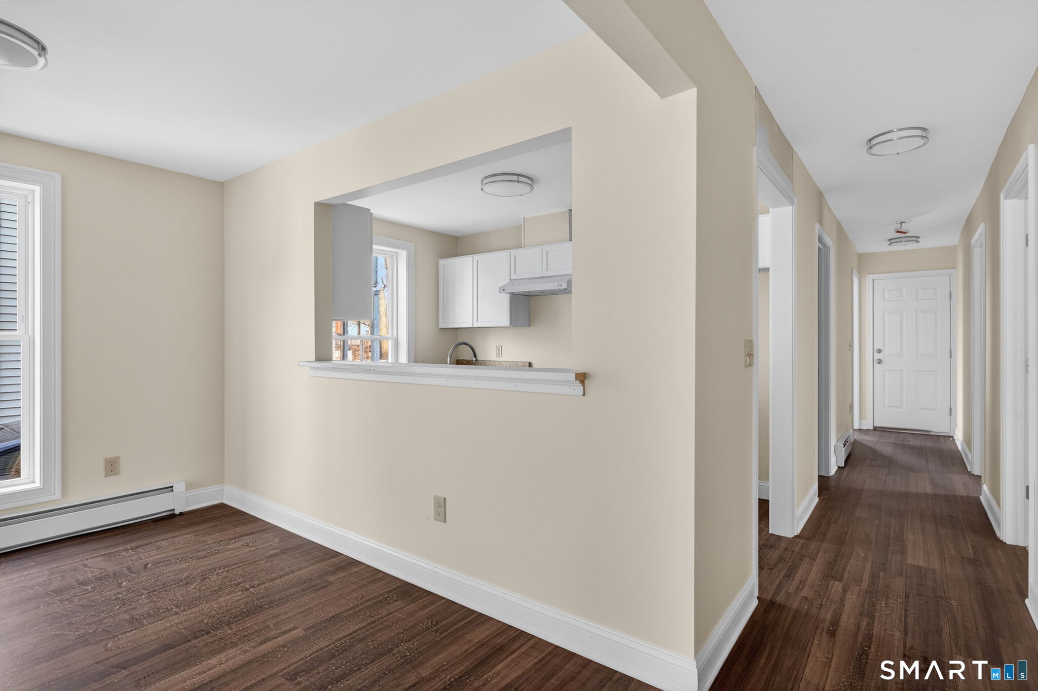 570 Zion Street Hartford, CT 06106 - Photo 23 of 40 a view of a kitchen from the hallway with wooden floor