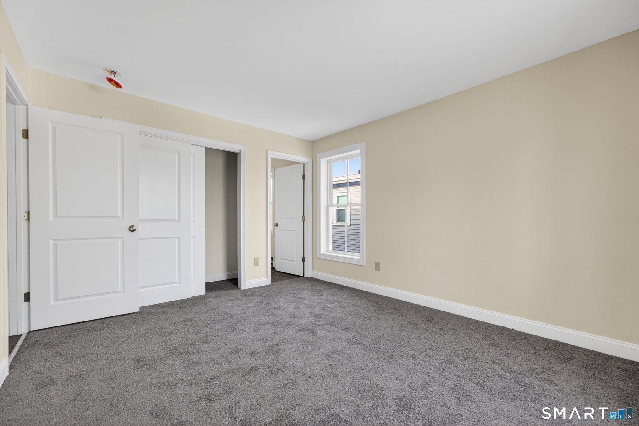 570 Zion Street Hartford, CT 06106 - Photo 30 of 40 a view of an empty room and window
