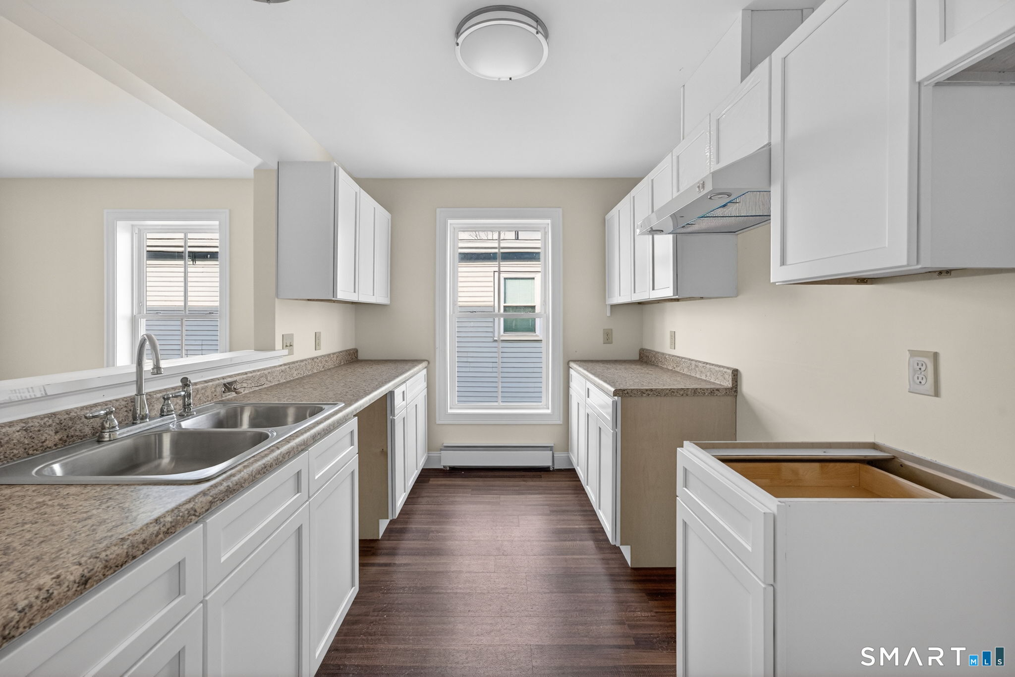 570 Zion Street Hartford, CT 06106 - Photo 4 of 40 a kitchen with a sink stove top oven and refrigerator