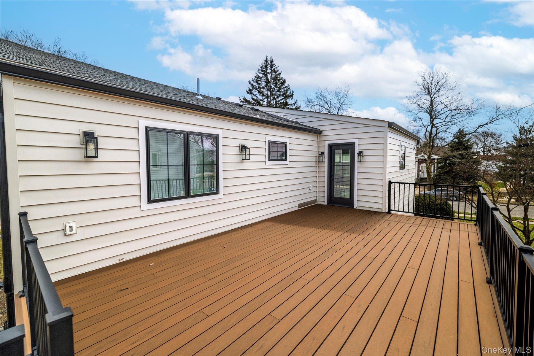 21 Dunhill Road New Hyde Park, NY 11040 - Photo 19 of 20 a view of a house with a roof deck