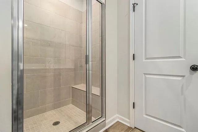 an empty room with windows and closet