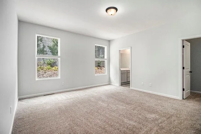 a view of a hallway with washer and dryer
