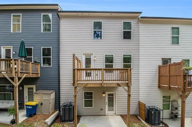 a view of balcony with wooden floor and fence