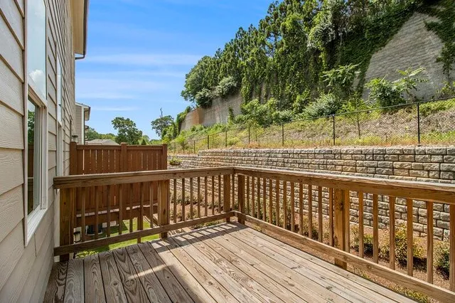 a view of a house with a backyard