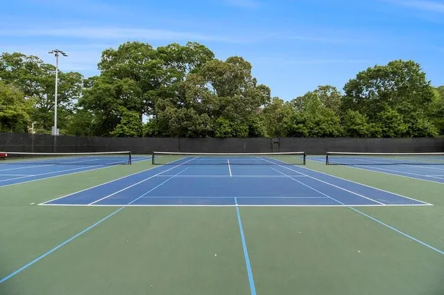 a view of a park with swings and a table
