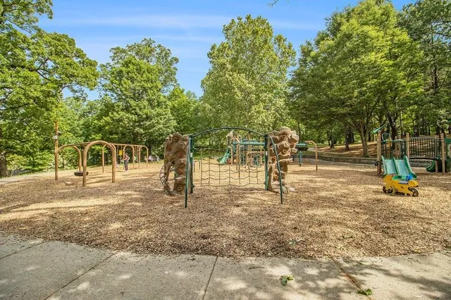 an outdoor sitting area with a tub