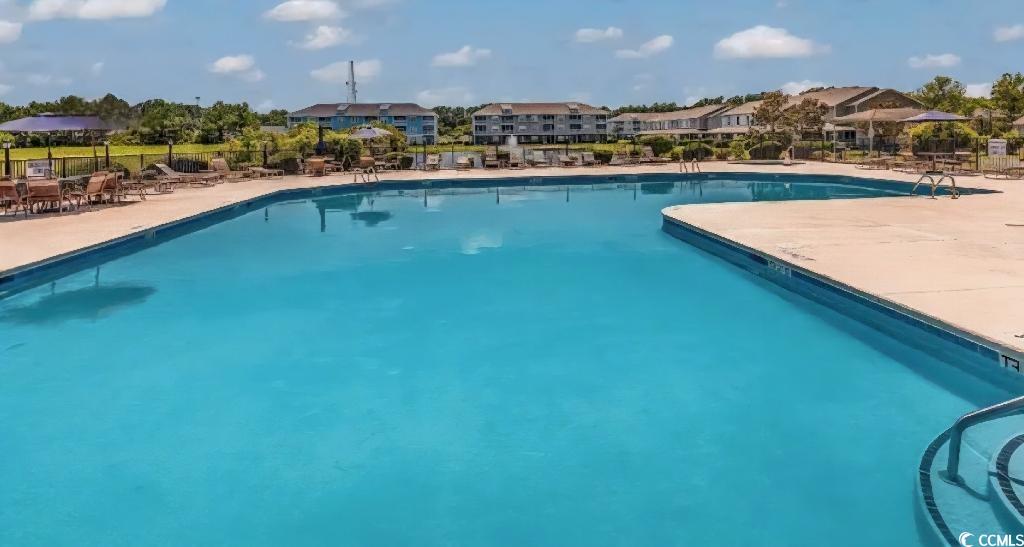 340 Kiskadee Loop, Unit O Conway, SC 29526 - Photo 12 of 13 Community pool featuring a residential view and a patio