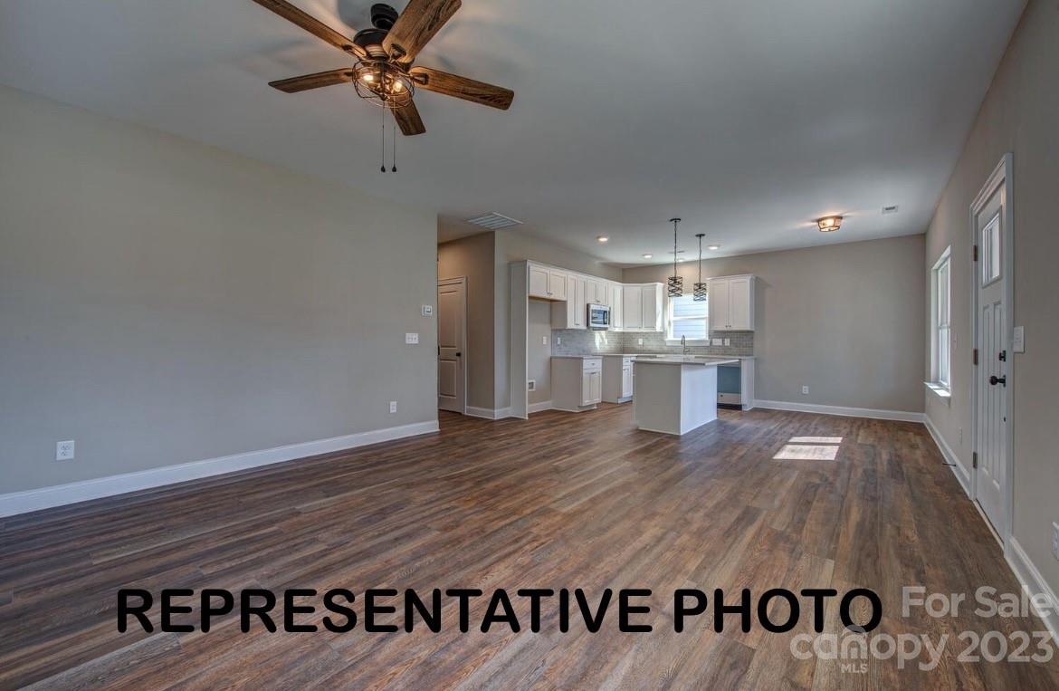 529 Blacksnake Road Stanley, NC 28164 - Photo 13 of 16 a view of kitchen with furniture and wooden floor