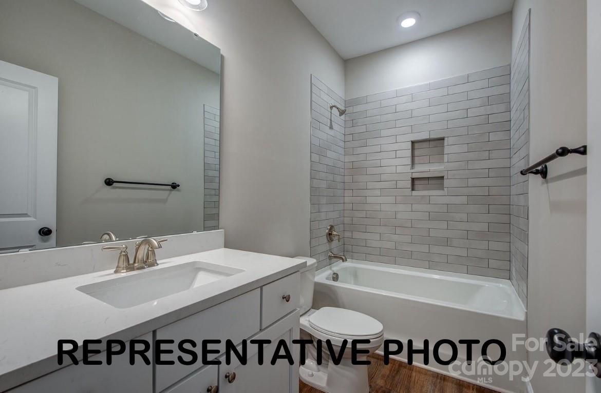 529 Blacksnake Road Stanley, NC 28164 - Photo 3 of 16 a bathroom with a sink and a bathtub