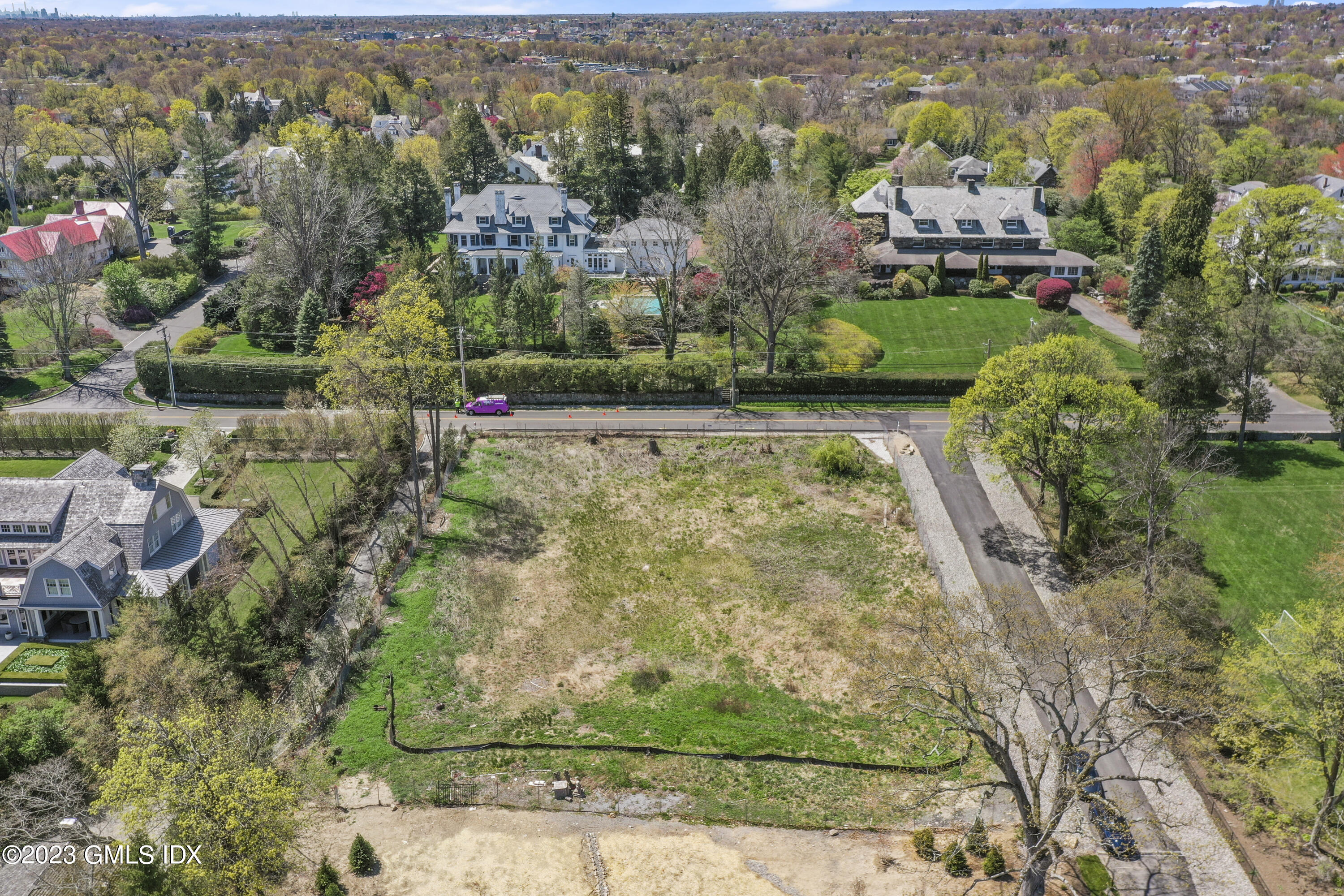 457 Field Point Road Greenwich, CT 06830 - Photo 2 of 5 an aerial view of residential houses with outdoor space and swimming pool