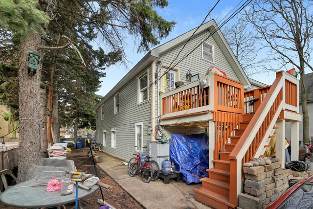 a view of a house with a chairs in a patio