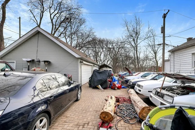 a view of a terrace with chairs and iron fence