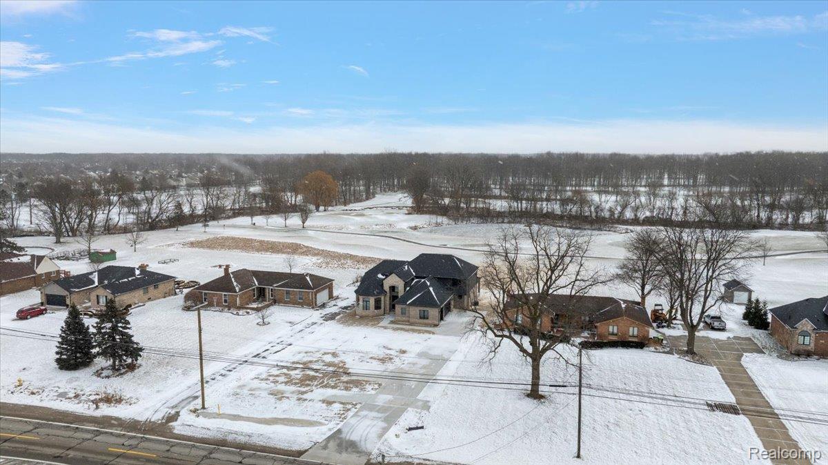 53650 Romeo Plank Road Macomb, MI 48042 - Photo 51 of 64 Snowy aerial view featuring a residential view