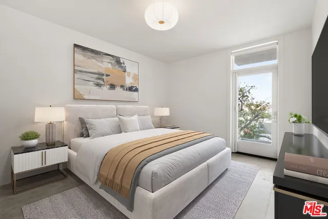 a bedroom with a bed and a couch