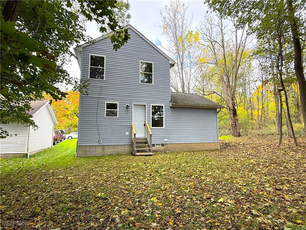 247 Reed Avenue Campbell, OH 44405 - Photo 37 of 41 Back of house featuring entry steps and a yard