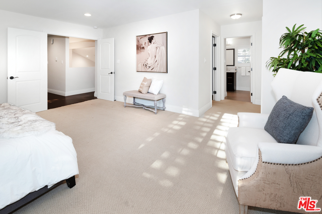 23030 Humming Bird Way Calabasas, CA 91302 - Photo 19 of 32 a bedroom with a bed and a couch