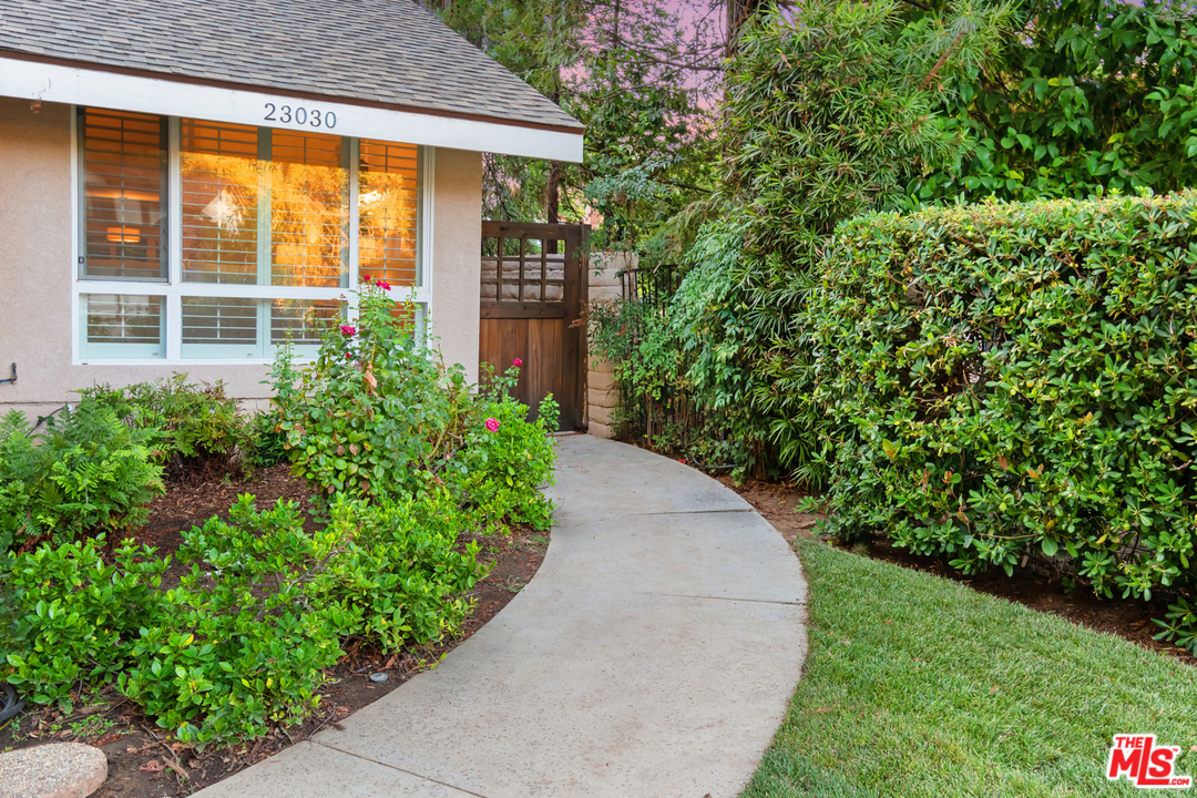 23030 Humming Bird Way Calabasas, CA 91302 - Photo 3 of 32 a view of a backyard with potted plants