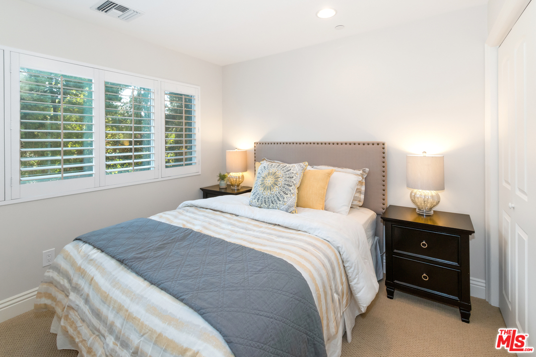 23030 Humming Bird Way Calabasas, CA 91302 - Photo 22 of 32 a bedroom with a bed and a closet