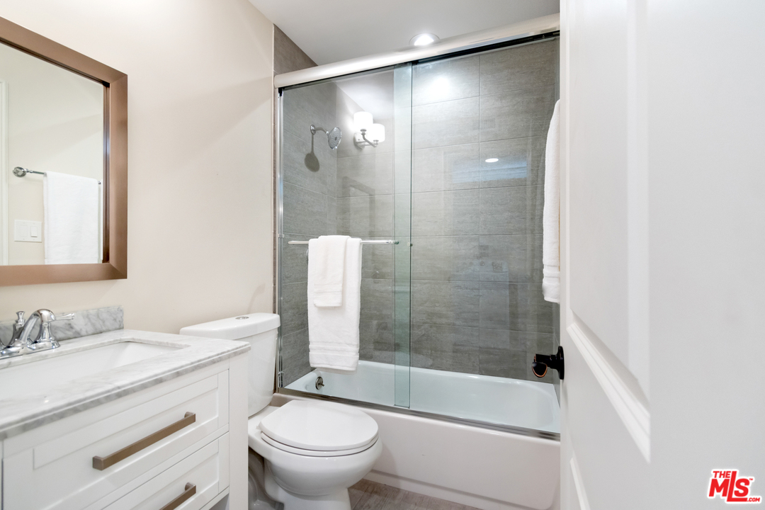 23030 Humming Bird Way Calabasas, CA 91302 - Photo 23 of 32 a bathroom with a sink toilet and shower