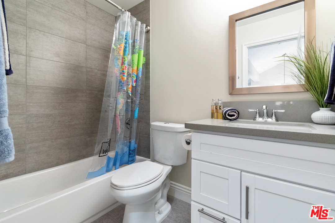 23030 Humming Bird Way Calabasas, CA 91302 - Photo 24 of 32 a bathroom with a sink a toilet and shower