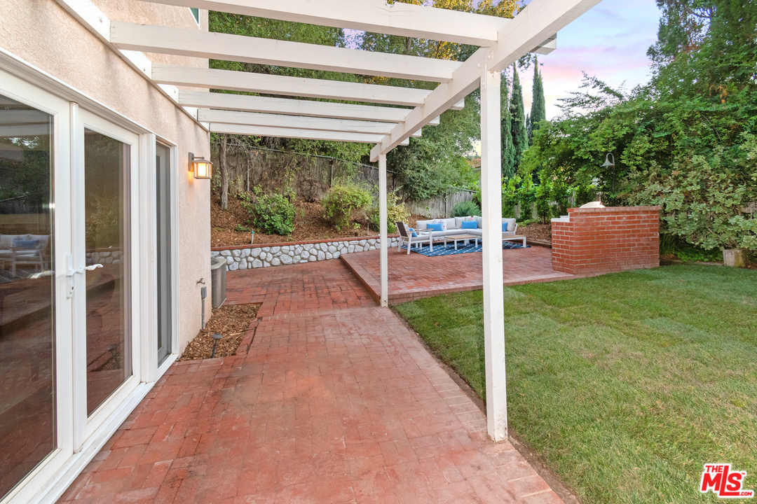 23030 Humming Bird Way Calabasas, CA 91302 - Photo 28 of 32 a view of a porch and garden