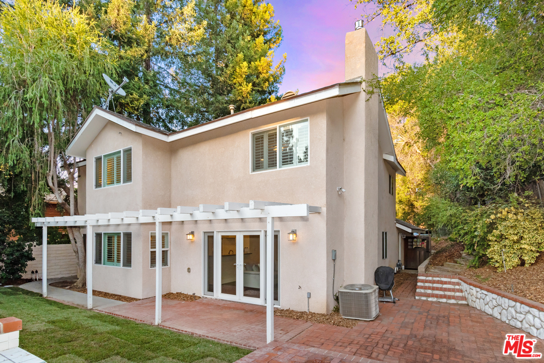 23030 Humming Bird Way Calabasas, CA 91302 - Photo 30 of 32 a view of a house with a yard and plants