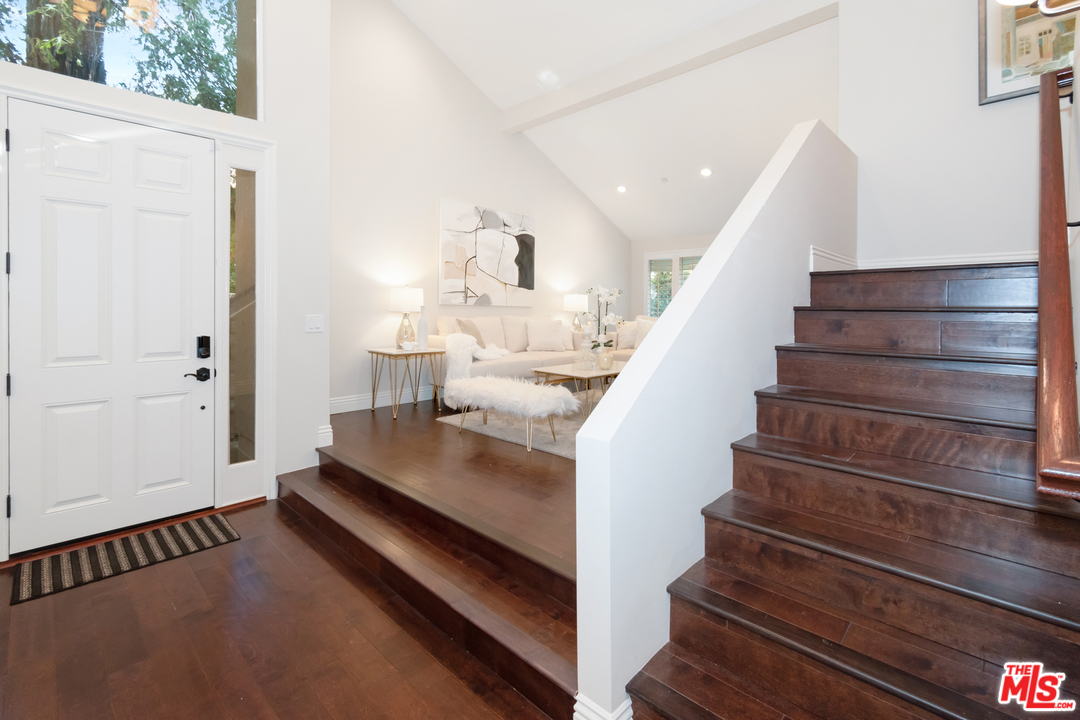 23030 Humming Bird Way Calabasas, CA 91302 - Photo 4 of 32 a view of entryway and hall with wooden floor
