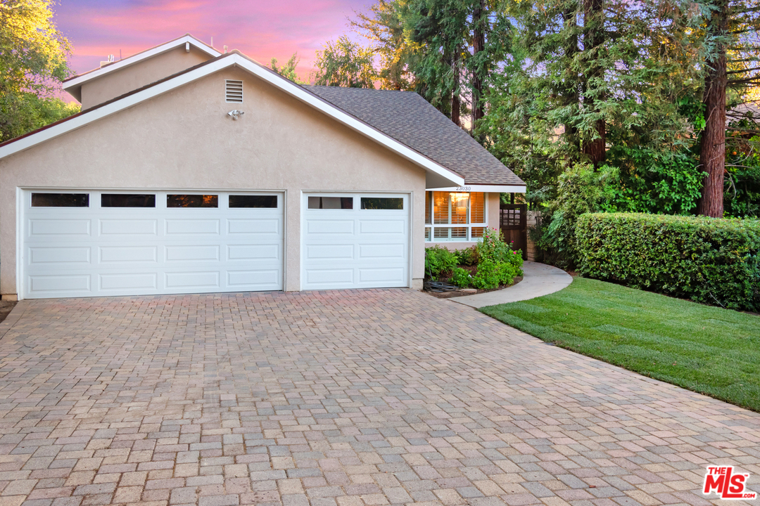 23030 Humming Bird Way Calabasas, CA 91302 - Photo 32 of 32 a front view of house with yard and trees all around