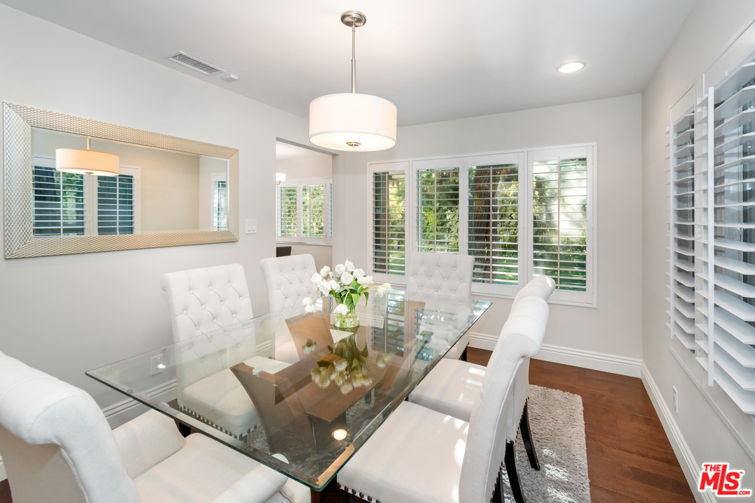 23030 Humming Bird Way Calabasas, CA 91302 - Photo 9 of 32 a living room with furniture and floor to ceiling windows