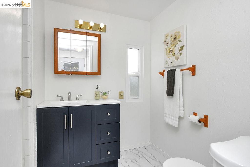 7550 Adams Road Valley Springs, CA 95252 - Photo 19 of 38 Bathroom with vanity and light marble finish flooring
