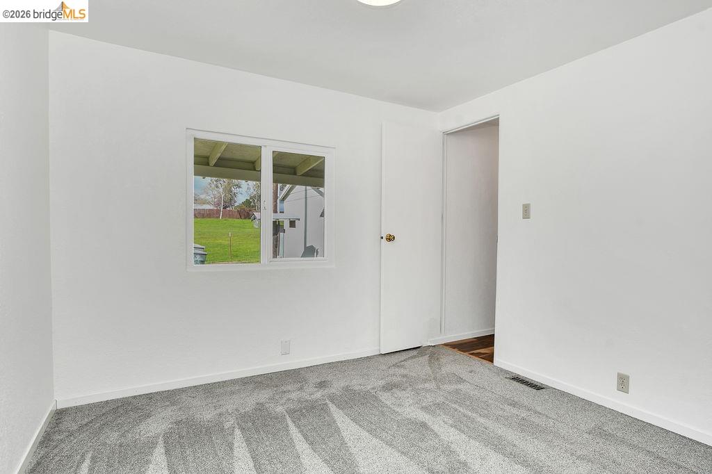 7550 Adams Road Valley Springs, CA 95252 - Photo 21 of 38 Unfurnished room with carpet flooring and baseboards