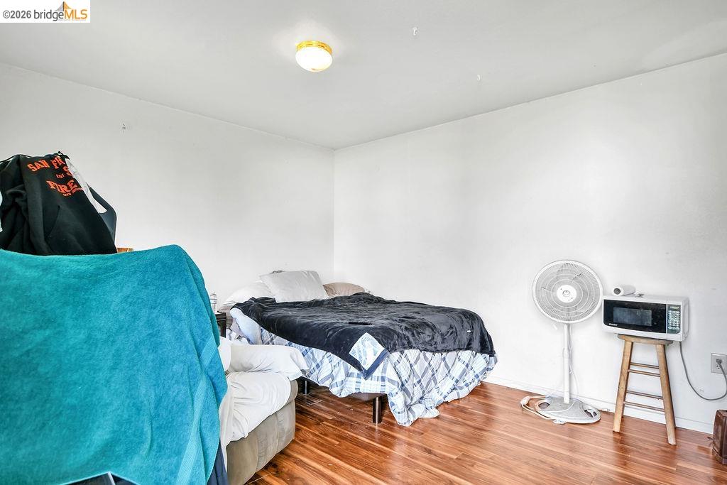 7550 Adams Road Valley Springs, CA 95252 - Photo 28 of 38 Bedroom with wood finished floors and baseboards