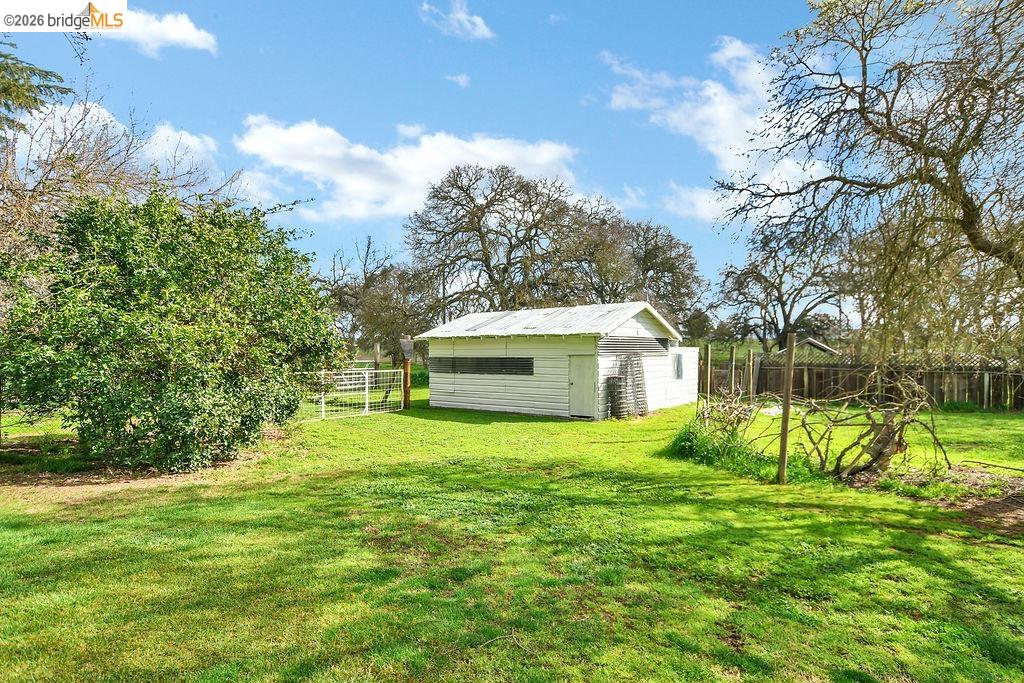 7550 Adams Road Valley Springs, CA 95252 - Photo 31 of 38 View of yard featuring an outdoor structure