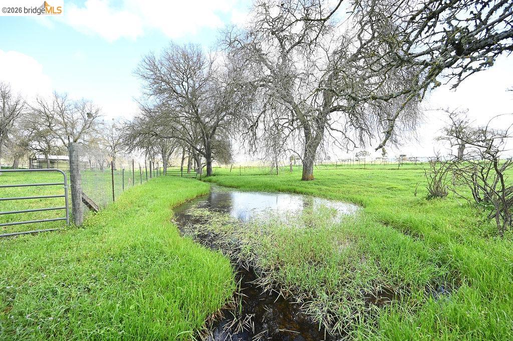 7550 Adams Road Valley Springs, CA 95252 - Photo 33 of 38 View of yard with a view of rural / pastoral area and a water view